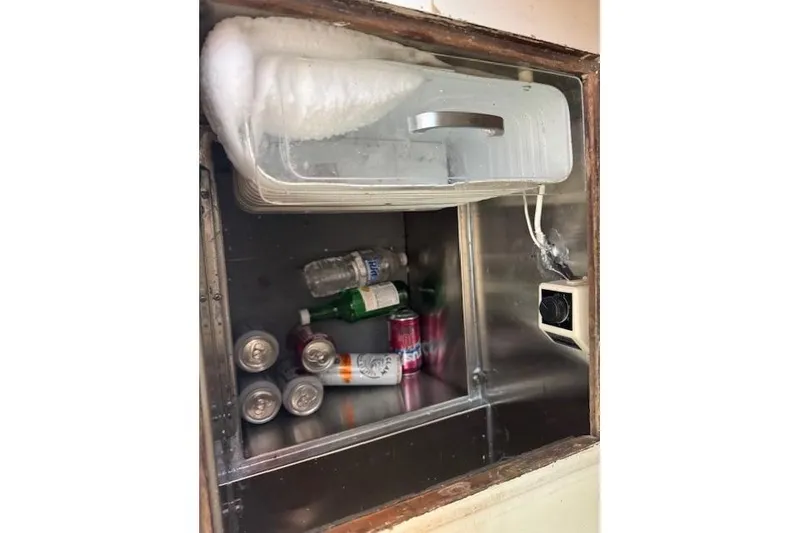 Slide: The Image of Refrigerator inside 1982 Catalina 38 yacht with drinks and ice buildup. - 25