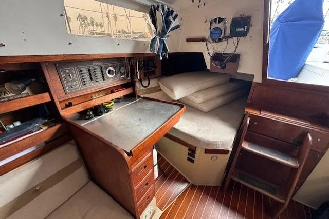 Slide: The Image of Interior of a 1982 Catalina 38 sailboat with navigation station and cozy cabin space. - 27