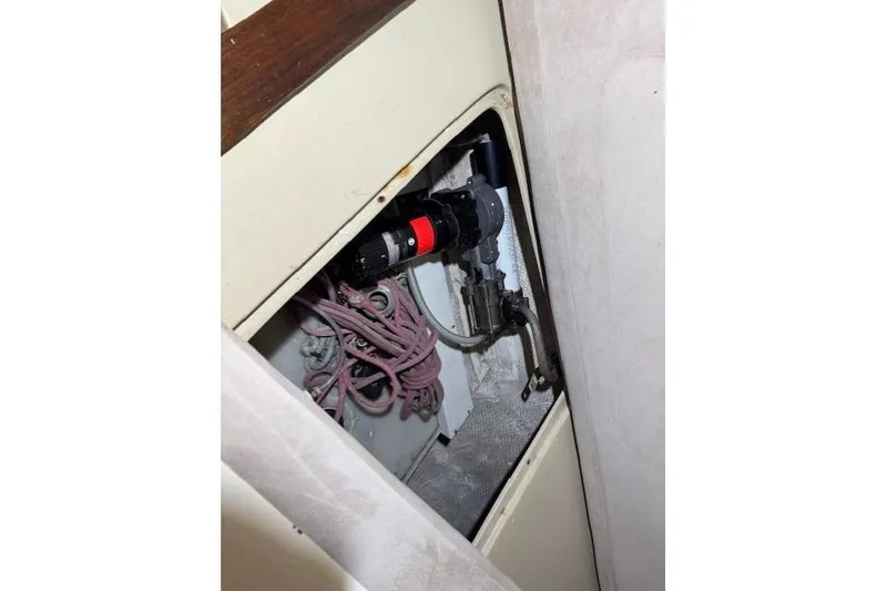 Slide: The Image of 1982 Catalina 38 interior compartment with wiring and equipment. - 32