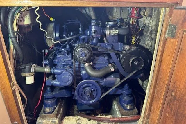 Slide: The Image of 1982 Catalina 38 engine compartment with visible components and wiring. - 34