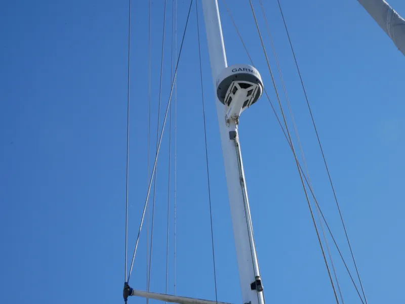 Slide: The Image of Mast and rigging of a 1982 Catalina 38 sailboat against a clear blue sky. - 8