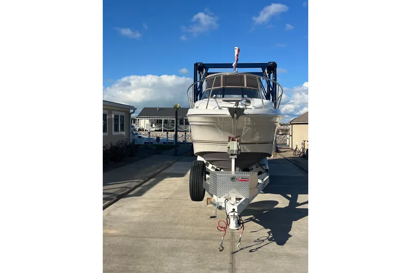 Slide: The Image of 2002 Regal Commodore 2765 boat on trailer under clear blue sky. - 1