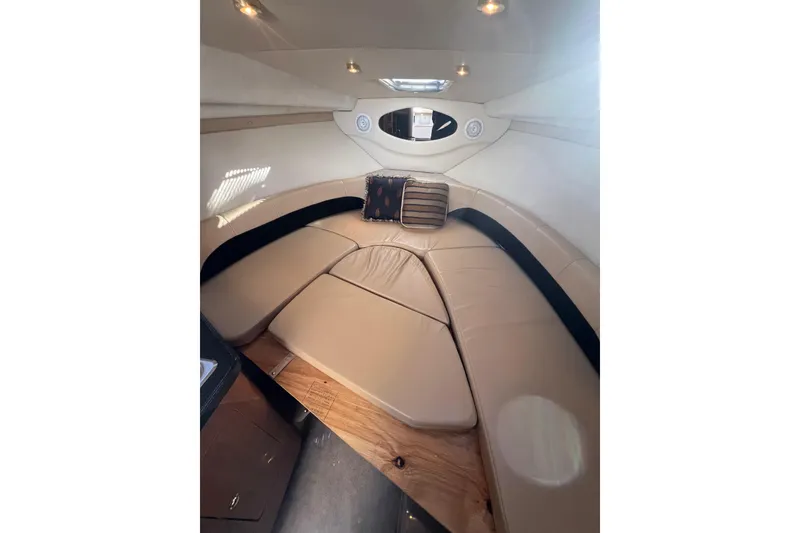 Slide: The Image of 2002 Regal Commodore 2765 cabin interior with beige seating and ambient lighting. - 12