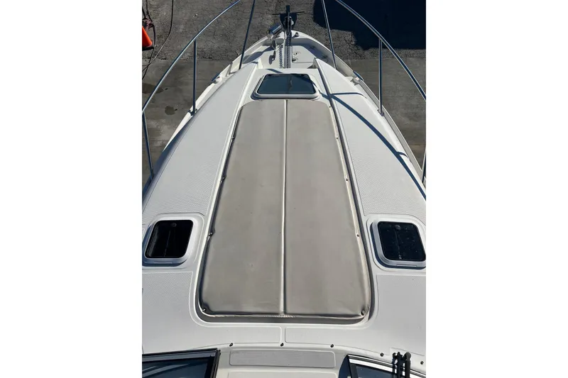 Slide: The Image of 2002 Regal Commodore 2765 boat deck with sunpad and hatches. - 17