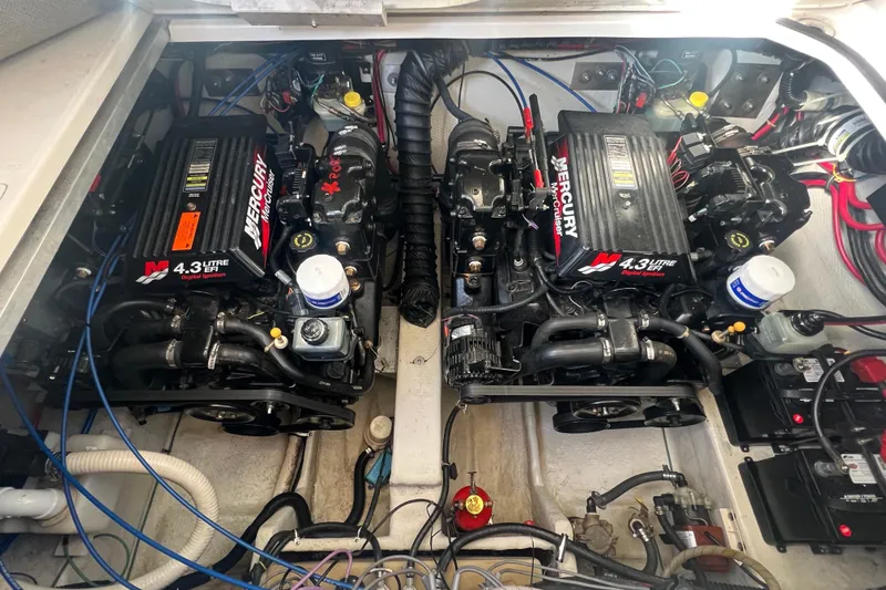 Slide: The Image of Twin Mercury engines in a 2002 Regal Commodore 2765 boat engine compartment. - 19