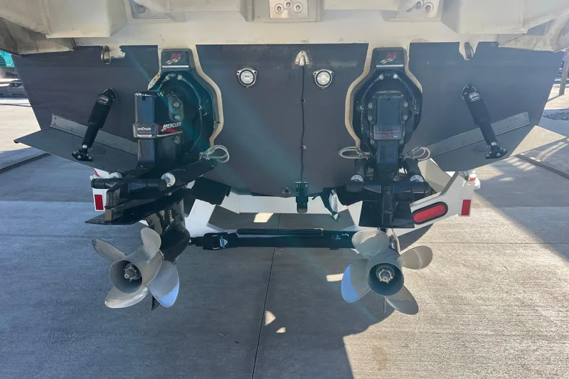 Slide: The Image of Rear view of 2002 Regal Commodore 2765 boat with dual Mercury outdrives. - 5