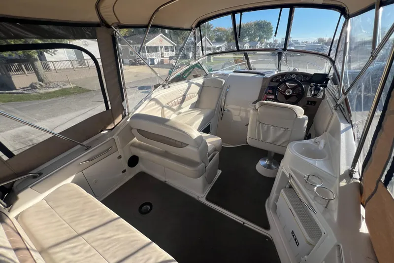 Slide: The Image of Interior of 2002 Regal Commodore 2765 boat with seating and steering area. - 6