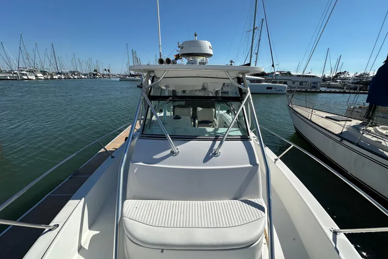 Slide: The Image of Helm of 2001 Boston Whaler 28 Outrage with Raymarine electronics and Mercury controls. - 11