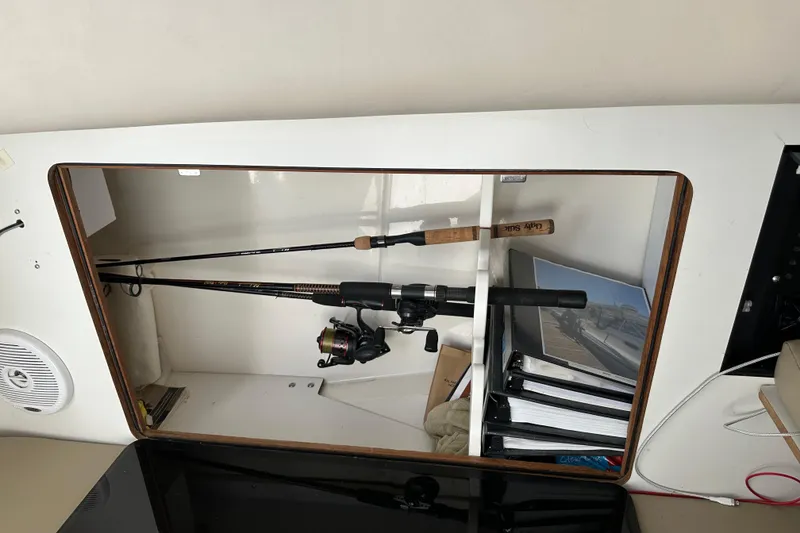 Slide: The Image of Boston Whaler 28 Outrage 2001 boat stern with Mercury engine on water. - 14