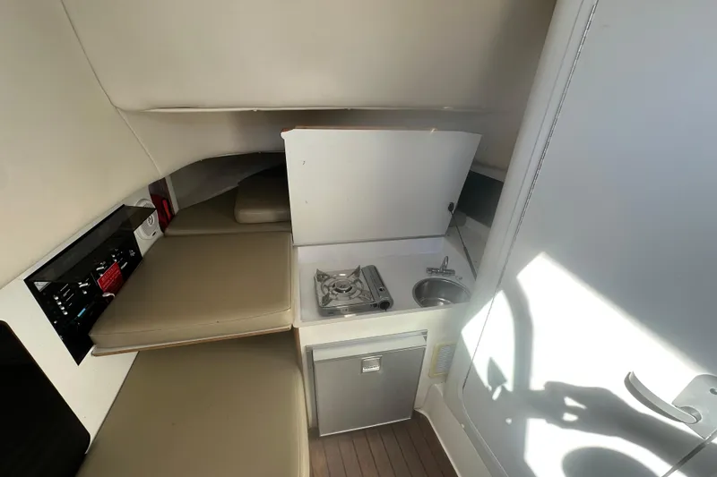 Slide: The Image of Microwave and control panel inside 2001 Boston Whaler 28 Outrage boat cabin. - 17