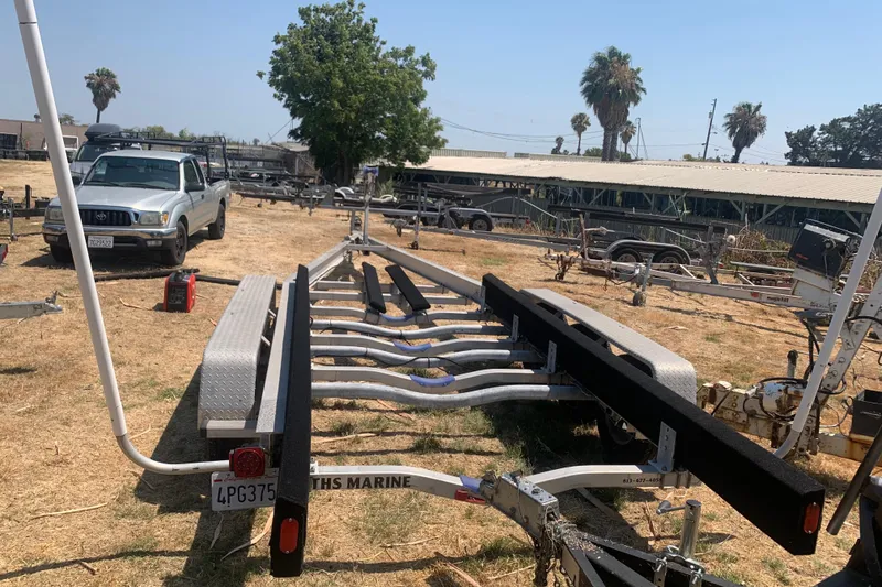 Slide: The Image of 2001 Boston Whaler 28 Outrage boat docked in a marina under clear blue skies. - 26