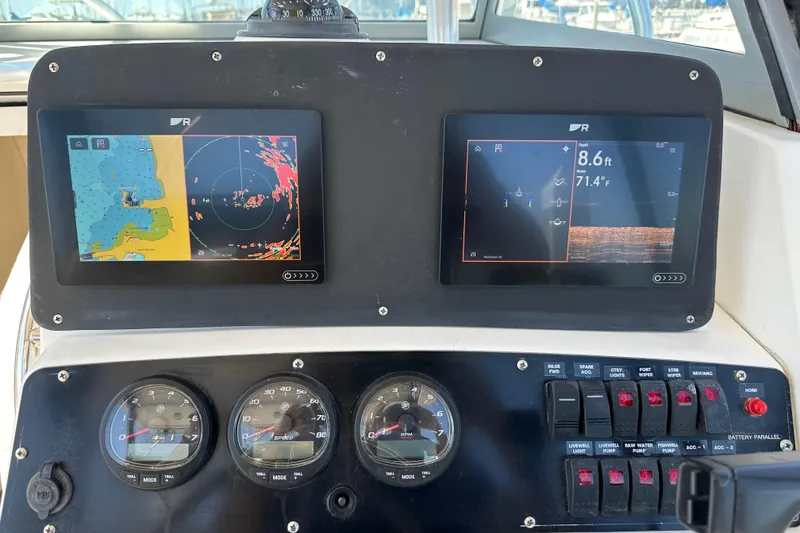 Slide: The Image of 2001 Boston Whaler 28 Outrage boat docked at marina under clear blue sky. - 9