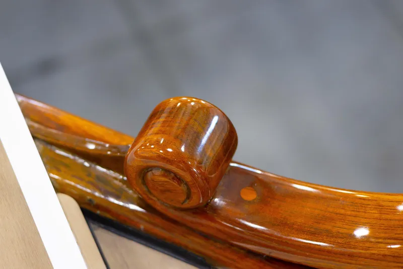 Slide: The Image of 1987 Grand Banks 32 Sedan boat deck with teak flooring and safety equipment. - 17