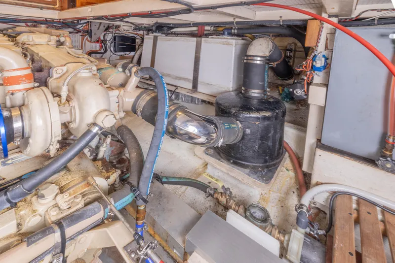 Slide: The Image of Engine room of a 1987 Grand Banks 32 Sedan with visible components and wiring. - 26