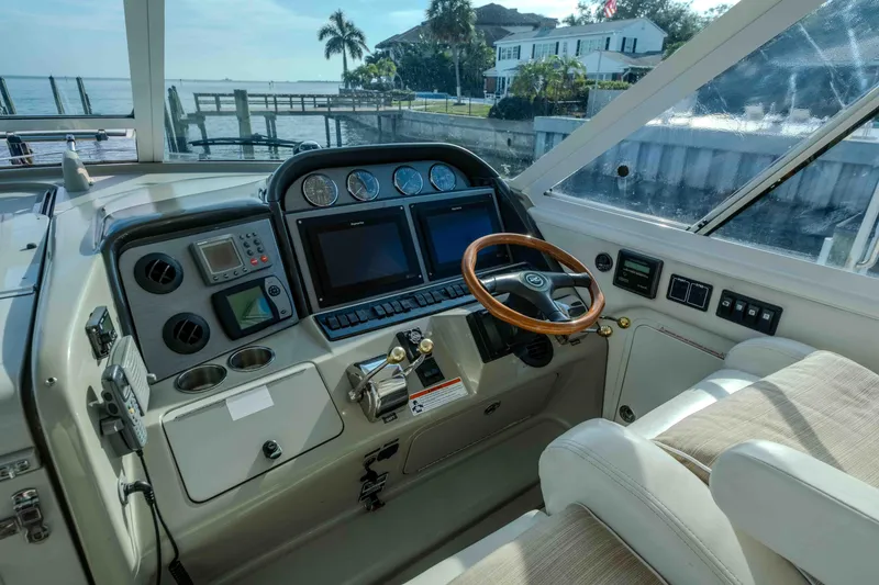 Slide: The Image of Luxurious interior of 2006 Sea Ray 40 Motor Yacht with seating, table, and TV. - 10
