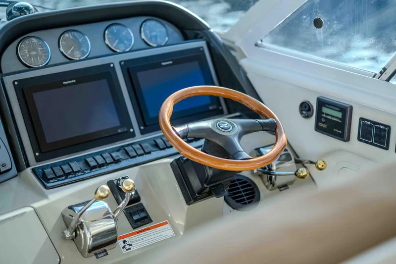 Slide: The Image of 2006 Sea Ray 40 Motor Yacht interior with helm, seating, and modern amenities. - 11