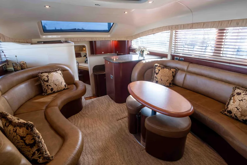 Slide: The Image of 2006 Sea Ray 40 Motor Yacht interior with helm, seating, and kitchenette. - 12