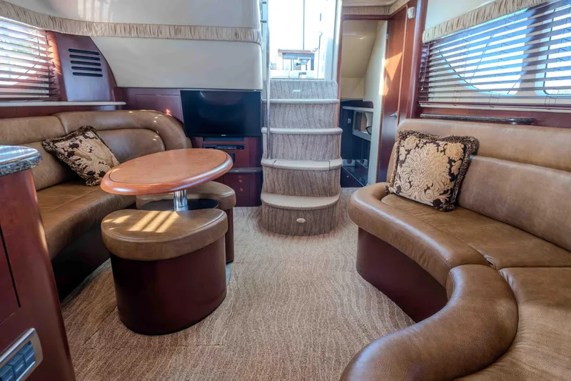 Slide: The Image of 2006 Sea Ray 40 Motor Yacht interior with sink, TV, and storage cabinets. - 13