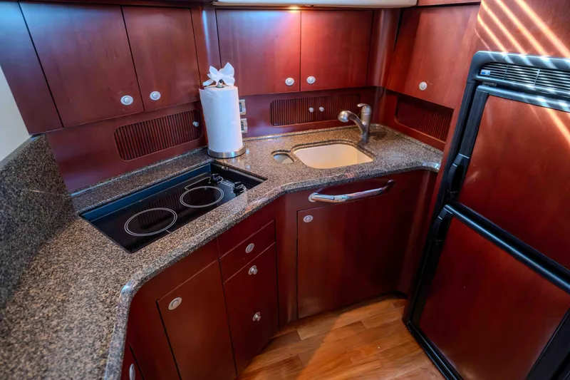 Slide: The Image of Luxurious 2006 Sea Ray 40 Motor Yacht interior with plush seating and elegant decor. - 18