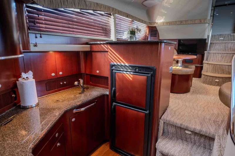 Slide: The Image of Luxurious interior of 2006 Sea Ray 40 Motor Yacht with plush seating and elegant decor. - 20