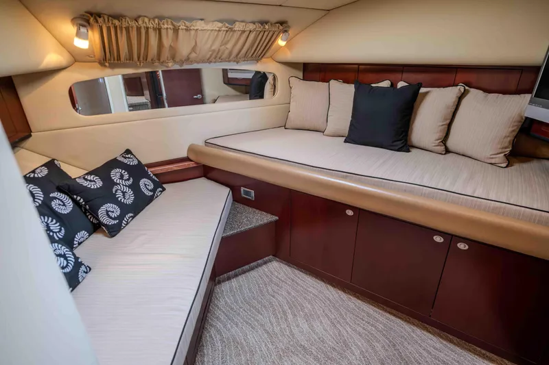 Slide: The Image of Luxurious 2006 Sea Ray 40 Motor Yacht kitchen with granite countertops and wood cabinetry. - 22