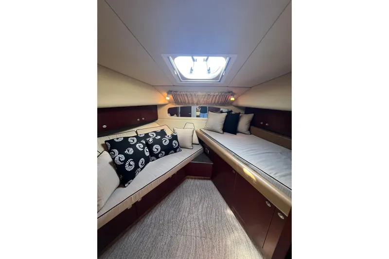 Slide: The Image of Luxurious 2006 Sea Ray 40 Motor Yacht interior with elegant wood cabinetry and modern amenities. - 25