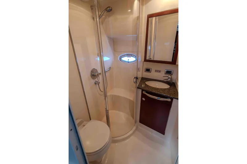 Slide: The Image of Luxurious cabin interior of 2006 Sea Ray 40 Motor Yacht with elegant bedding and cushions. - 26