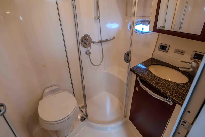 Slide: The Image of Luxurious interior of 2006 Sea Ray 40 Motor Yacht with elegant seating and cushions. - 27