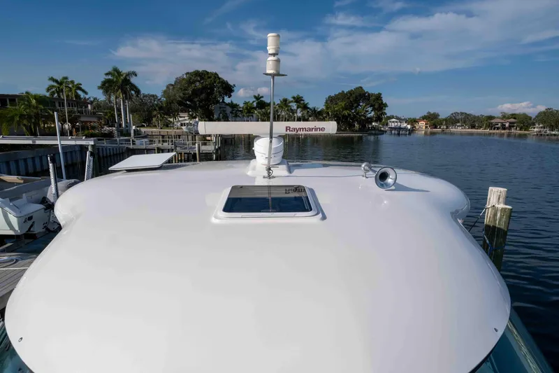 Slide: The Image of 2006 Sea Ray 40 Motor Yacht docked in clear green water, aerial view. - 3