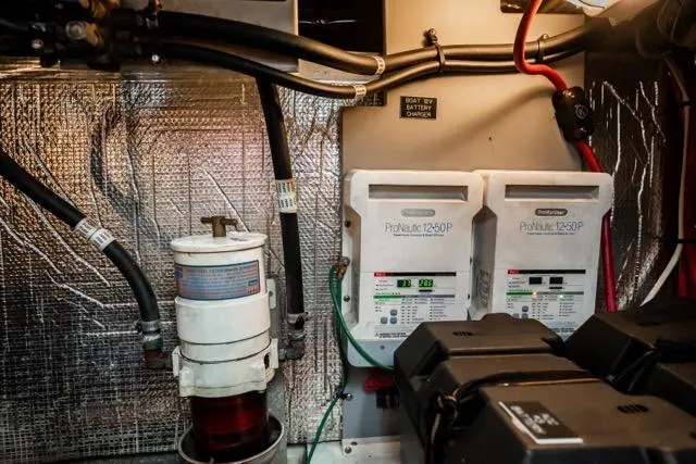 Slide: The Image of Engine room of 2005 Cruiser Yachts 405 EXPRESS with electrical components and wiring. - 101