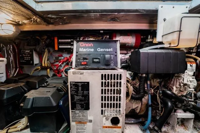 Slide: The Image of Engine room of 2005 Cruiser Yachts 405 EXPRESS with Onan Marine Genset. - 102