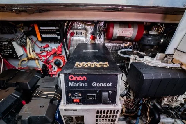 Slide: The Image of Engine room of 2005 Cruiser Yachts 405 EXPRESS with Onan Marine Genset. - 103