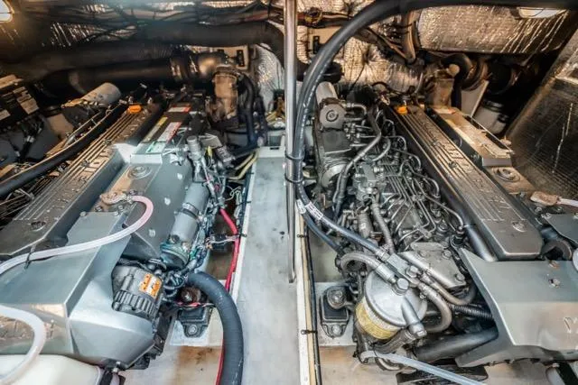 Slide: The Image of Engine room of 2005 Cruiser Yachts 405 EXPRESS, showcasing dual engines and mechanical components. - 109