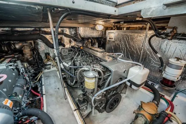 Slide: The Image of Engine room of 2005 Cruiser Yachts 405 EXPRESS, showcasing detailed mechanical components. - 110