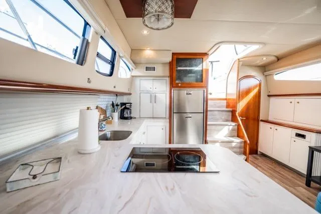Slide: The Image of Luxurious 2005 Cruiser Yachts 405 EXPRESS interior with modern kitchen and elegant design. - 12