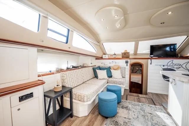 Slide: The Image of Luxurious interior of 2005 Cruiser Yachts 405 EXPRESS with elegant seating and modern amenities. - 14