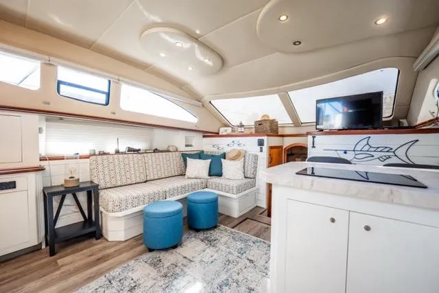 Slide: The Image of Luxurious interior of 2005 Cruiser Yachts 405 EXPRESS with modern seating and decor. - 15