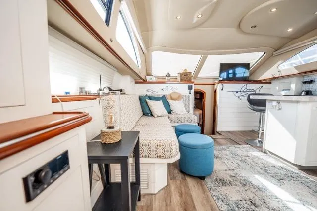 Slide: The Image of Luxurious interior of 2005 Cruiser Yachts 405 EXPRESS with elegant seating and modern decor. - 21