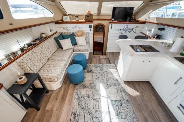 Slide: The Image of Interior of 2005 Cruiser Yachts 405 EXPRESS with modern decor and cozy seating area. - 3