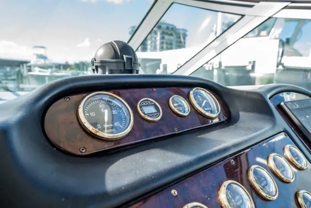 Slide: The Image of Dashboard of 2005 Cruiser Yachts 405 EXPRESS with gauges and compass. - 35