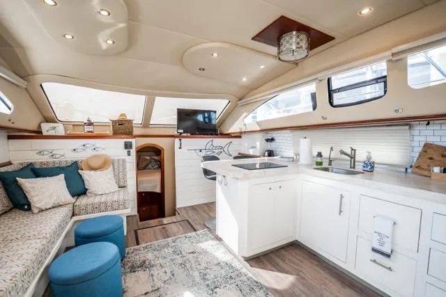 Slide: The Image of Luxurious interior of 2005 Cruiser Yachts 405 EXPRESS with modern kitchen and cozy seating area. - 4