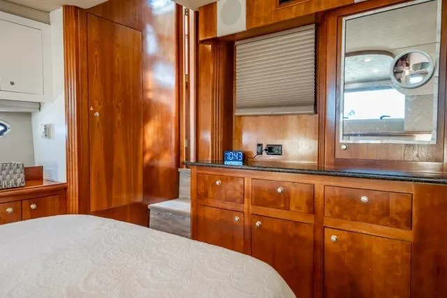 Slide: The Image of Luxurious 2005 Cruiser Yachts 405 EXPRESS cabin interior with wood cabinetry and modern amenities. - 45