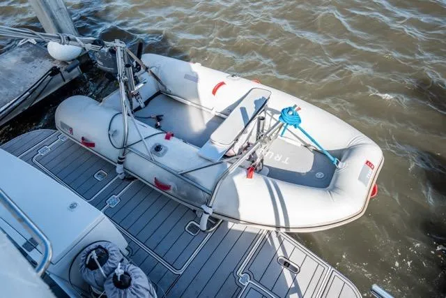 Slide: The Image of Inflatable dinghy on 2005 Cruiser Yachts 405 EXPRESS, docked on a sunny day. - 49