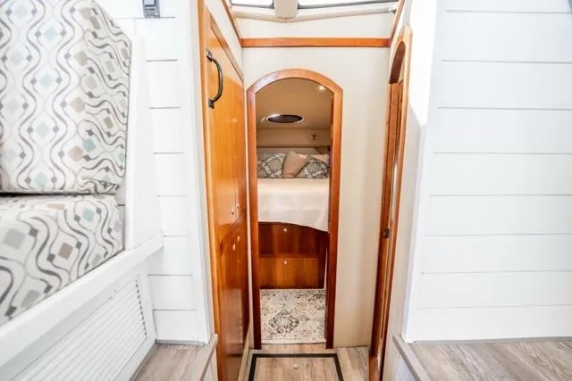 Slide: The Image of 2005 Cruiser Yachts 405 EXPRESS interior with cozy cabin and elegant wood finish. - 54