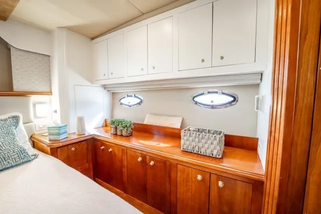 Slide: The Image of Luxurious cabin interior of 2005 Cruiser Yachts 405 EXPRESS with elegant wood cabinetry. - 60