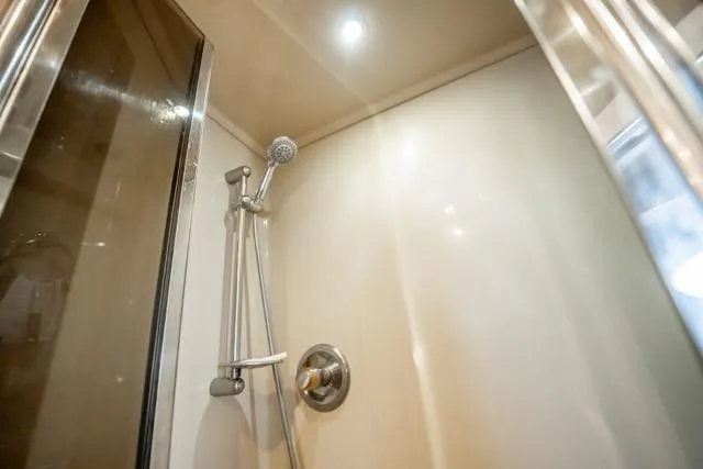 Slide: The Image of Shower area in 2005 Cruiser Yachts 405 EXPRESS, featuring modern fixtures and lighting. - 65