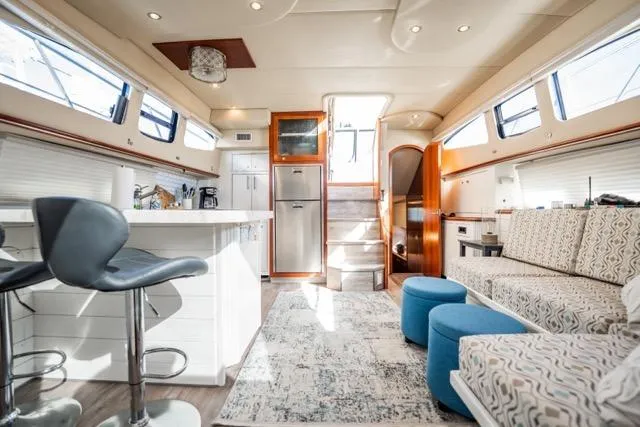 Slide: The Image of Luxurious 2005 Cruiser Yachts 405 EXPRESS interior with modern kitchen and cozy seating area. - 7