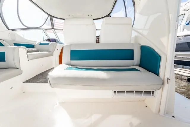 Slide: The Image of 2005 Cruiser Yachts 405 EXPRESS interior with white and teal seating. - 75