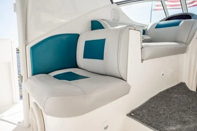 Slide: The Image of 2005 Cruiser Yachts 405 EXPRESS interior seating with blue and white upholstery. - 77