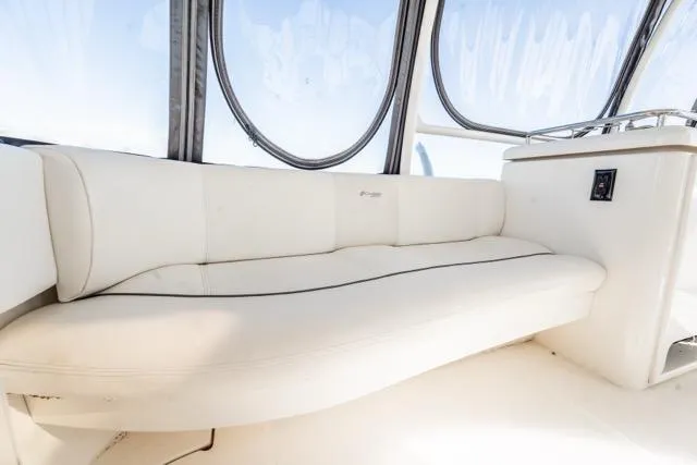 Slide: The Image of Luxurious seating on 2005 Cruiser Yachts 405 EXPRESS, featuring elegant white upholstery. - 81